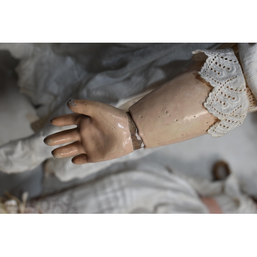 89 - An Etienne Denamur Depose bisque porcelain head bebe companion doll, no. 13, with composition body a... 