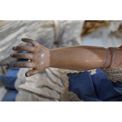 130 - A vintage Kestner doll with bisque socket head impressed 'R4D', heavy feathered brows, blue glass sl... 