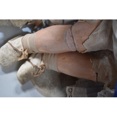 130 - A vintage Kestner doll with bisque socket head impressed 'R4D', heavy feathered brows, blue glass sl... 