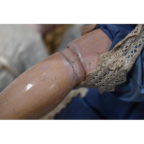 130 - A vintage Kestner doll with bisque socket head impressed 'R4D', heavy feathered brows, blue glass sl... 