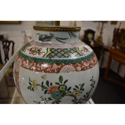 259 - A group of lamp bases, to include a large baluster form Chinese polychrome lamp base, together with ... 