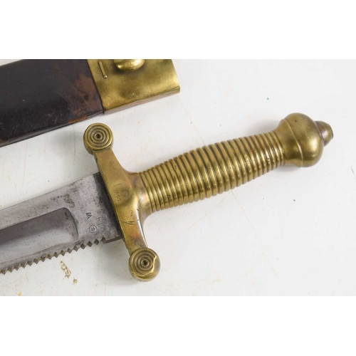 100 - A German 1842/43 pattern Pioneer sword with saw blade edge and brass grip, the grip stamped 1847, th... 