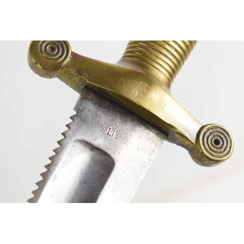 100 - A German 1842/43 pattern Pioneer sword with saw blade edge and brass grip, the grip stamped 1847, th... 