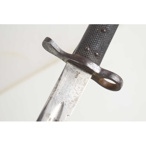 103 - A British 1875 pattern sawback bayonet and scabbard for Martini Henry Rifle, F.W stamped to the rica... 