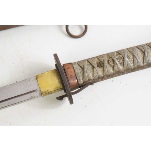 104 - A Japanese WWII NCO shin gunto sword, with brass shaped and pebbled tsuba above Kokura arsenal stamp... 