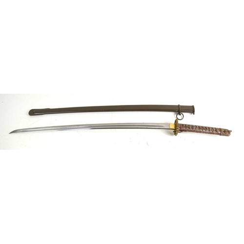 105 - A Japanese WWII NCO shin gunto sword, with brass shaped and pebbled tsuba above arsenal marks and re... 