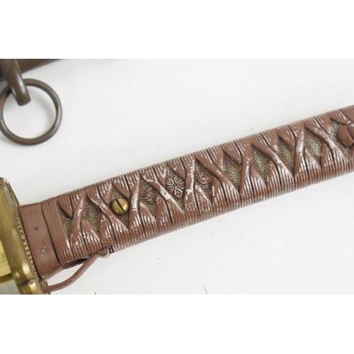 105 - A Japanese WWII NCO shin gunto sword, with brass shaped and pebbled tsuba above arsenal marks and re... 