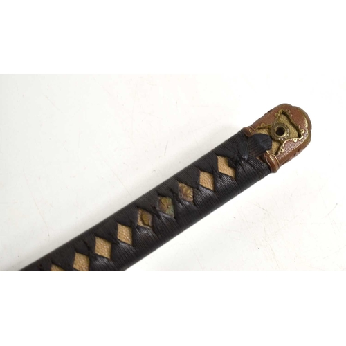 110 - A WWII era Japanese officers Shin Gunto Katana, the 68cm steel blade with undulating hamon, signed t... 