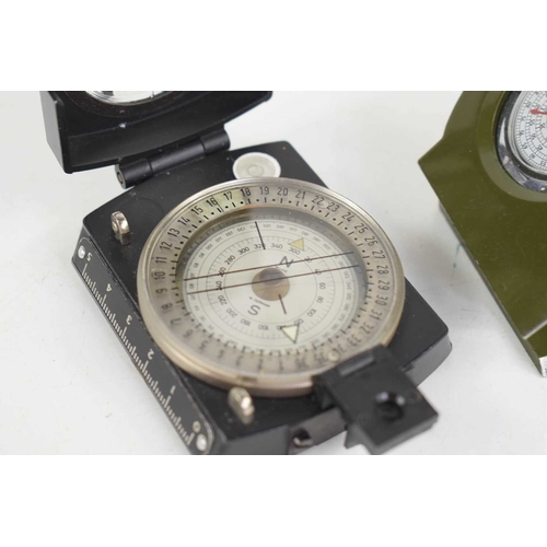 112 - A green Chinese Army PLA type 51/62 compass, and a black Steigung Wickie Prismatic sighting compass.... 