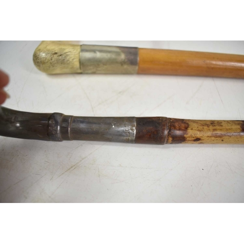 113 - A pair of walking canes, one bamboo with silver handle, 94cm, and another walking cane with horn han... 