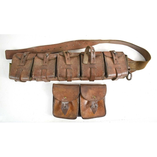 120 - A WWI era Swedish M10 five pouch leather bandolier together with a leather double magazine pouch, po... 