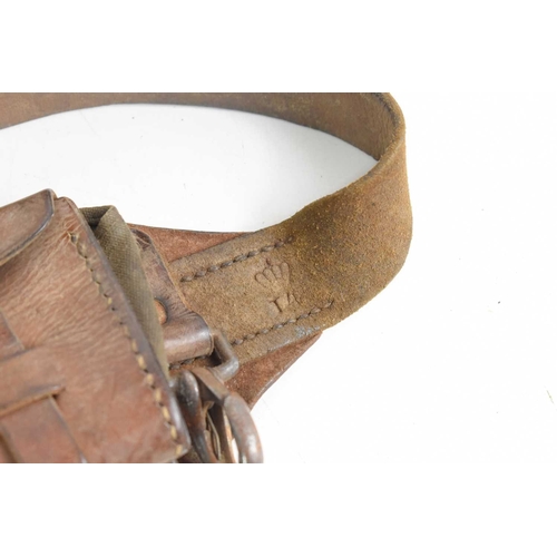 120 - A WWI era Swedish M10 five pouch leather bandolier together with a leather double magazine pouch, po... 