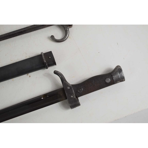 70 - A group of bayonets to include a French 1892 pattern bayonet with scabbard, a French 1874 pattern Gr... 