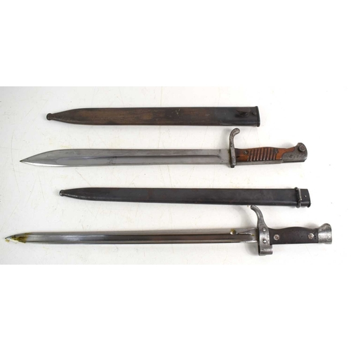 77 - A French 1892 pattern bayonet with scabbard, numbered 67612, together with a German model M1898/05 “... 
