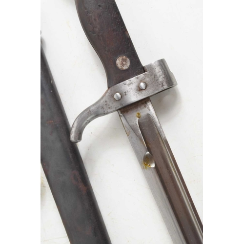 77 - A French 1892 pattern bayonet with scabbard, numbered 67612, together with a German model M1898/05 “... 