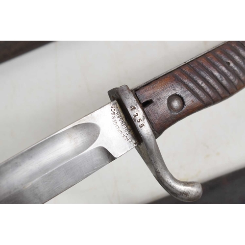 77 - A French 1892 pattern bayonet with scabbard, numbered 67612, together with a German model M1898/05 “... 
