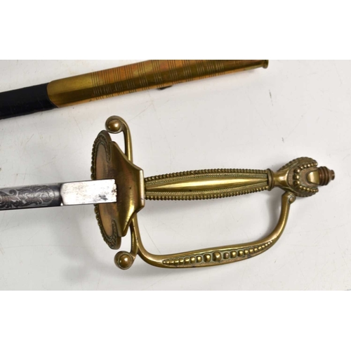 78 - A Victorian court sword, the etched blade measuring 79cm, with brass and leather scabbard.