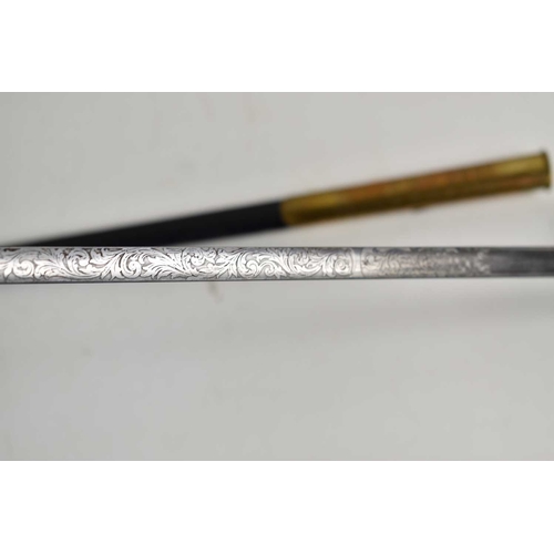 78 - A Victorian court sword, the etched blade measuring 79cm, with brass and leather scabbard.
