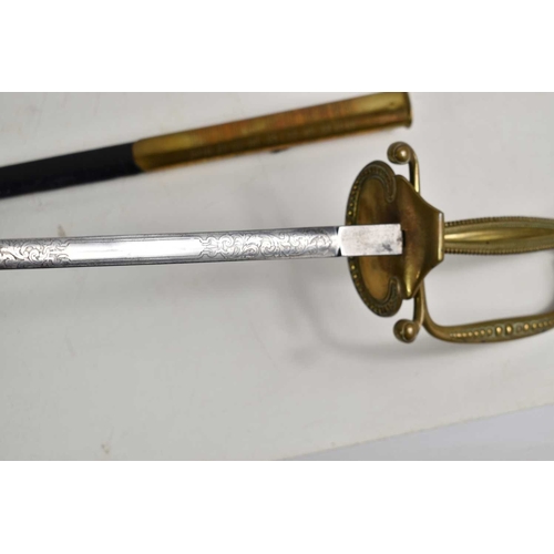 78 - A Victorian court sword, the etched blade measuring 79cm, with brass and leather scabbard.