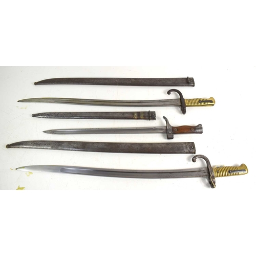 83 - A French model 1892 modified bayonet together with two French model 1866 chassepot bayonets, one exa... 