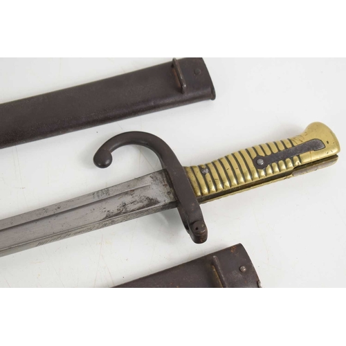 87 - A group of three French model 1866 Chassepot sword bayonets with Yataghan recurved T form blade, one... 