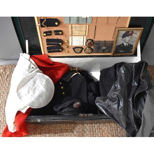 99 - A group of militaria relating to A.M Diarmid of the Merchant Navy, to include a metal travelling tru... 