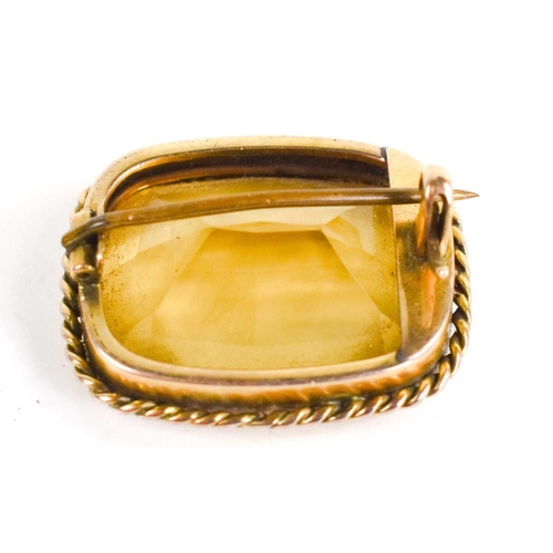 13 - An antique gold and citrine brooch, 2cm by 2.1cm, unmarked but testing as gold.