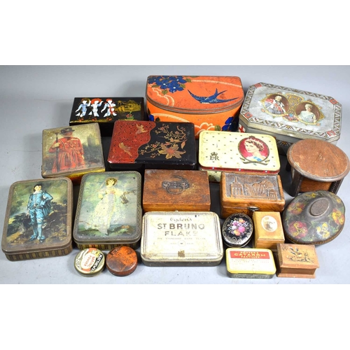 182 - A group of vintage metal tins and wooden boxes of various sizes and designs, together with a comical... 