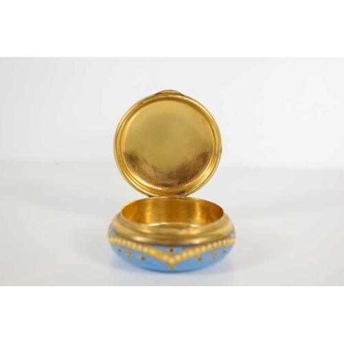261 - A 19th century, likely French blue enamel pill box, handpainted with floral motifs in white blue and... 