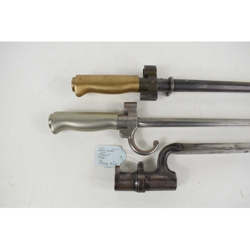 295 - A British Pattern 1876 socket bayonet for use with the Martini-Henry rifle, together with two French... 