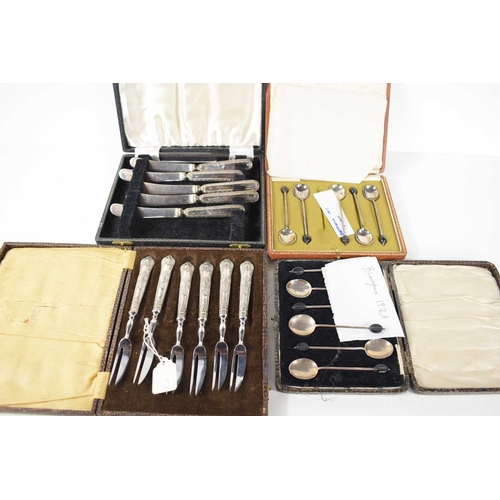 330 - A group of silver and silver plate to include two sets of silver coffee spoons, a silver match box h... 