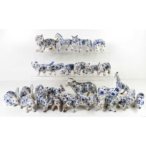 138 - A collection of 19th century and later Delft blue and white tin glazed ceramic animals to include ca... 