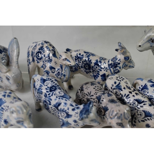138 - A collection of 19th century and later Delft blue and white tin glazed ceramic animals to include ca... 