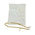 An antique gold watch chain, with a letter stating it was handmade from ...