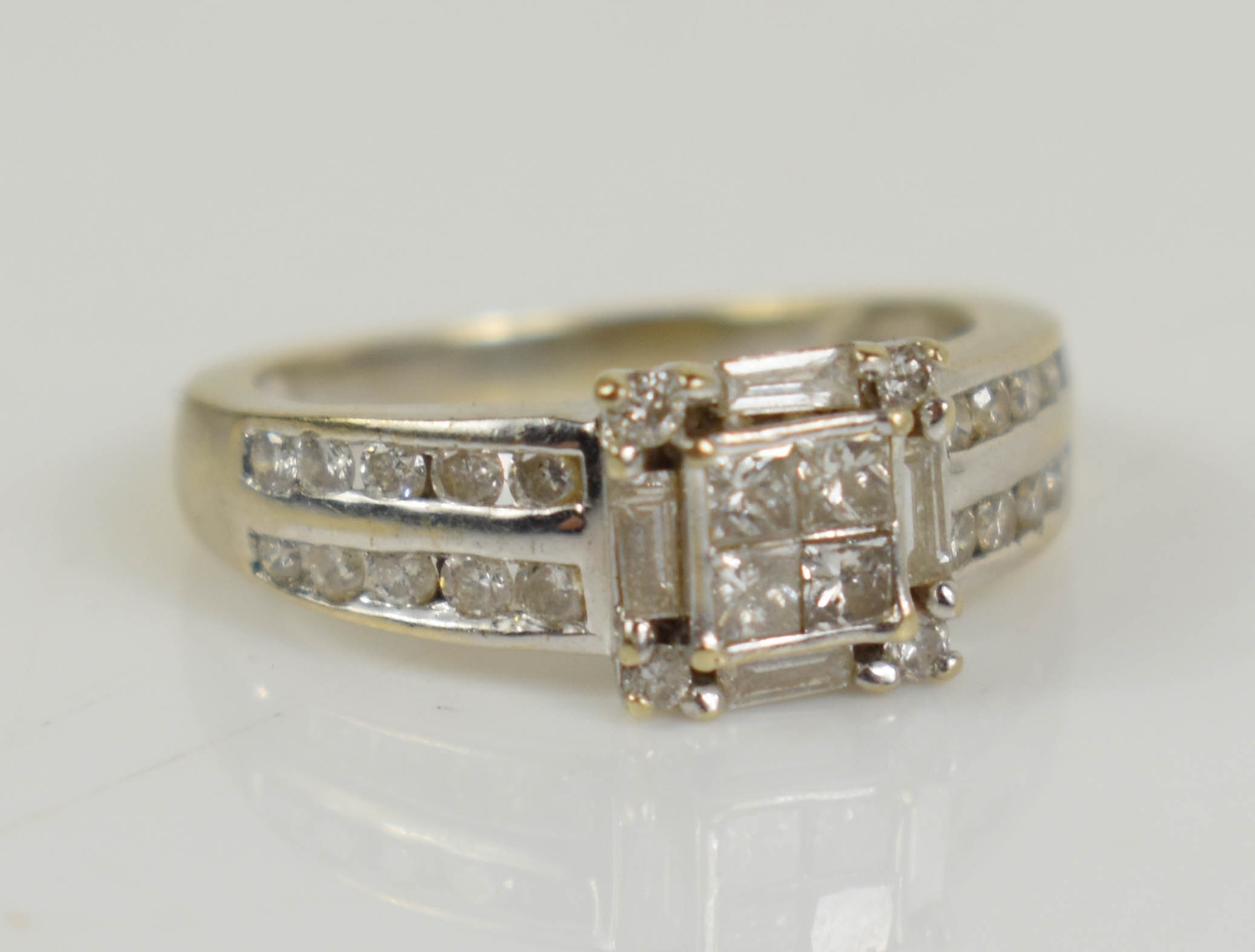 An 18ct white gold and diamond engagement ring, set with princess ...