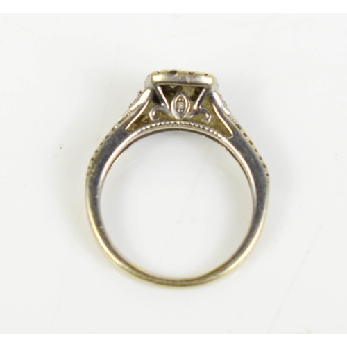 A 14ct white gold and diamond cluster ring of square form, size K, 2.4g.