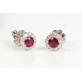 A pair of 18ct white gold, ruby and diamond cluster stud earrings ...