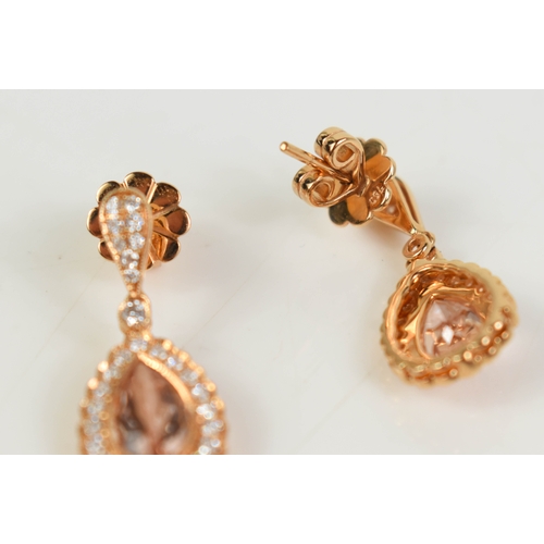 A pair of 18ct gold drop earrings with a pear cut peach morganite ...