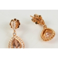 A pair of 18ct gold drop earrings with a pear cut peach morganite ...