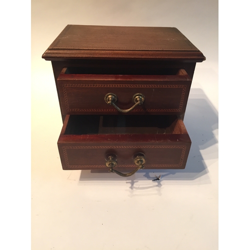 145 - Miniature  two drawer chest measures 20x25x20cms