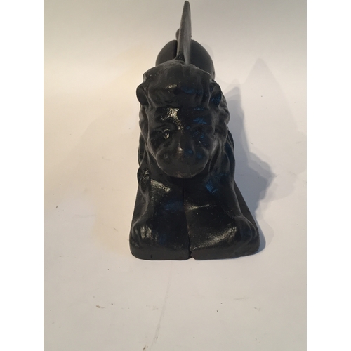 162 - A nice quality cast iron footscrape in form of lion