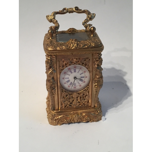 114 - Small gilt French carrage clock measures 7x4cms