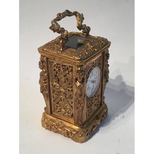 114 - Small gilt French carrage clock measures 7x4cms