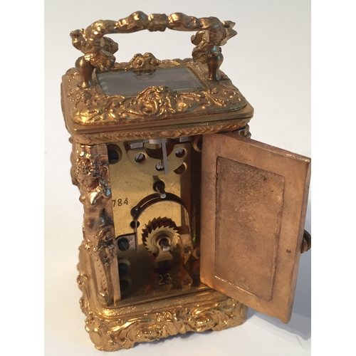 114 - Small gilt French carrage clock measures 7x4cms