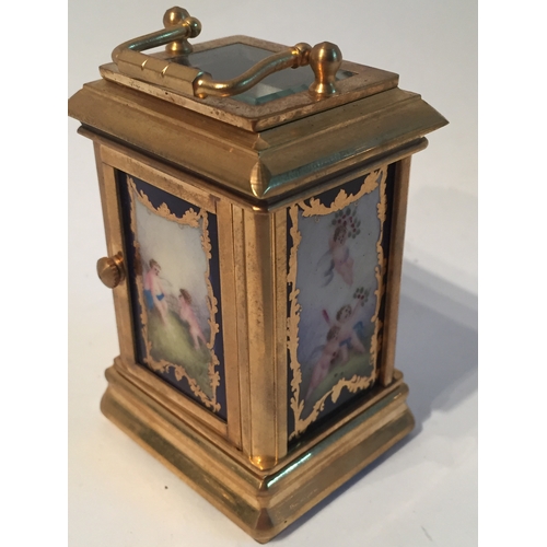 115 - Small Gilded Sevres Style  carriage clock measures 8x5cms