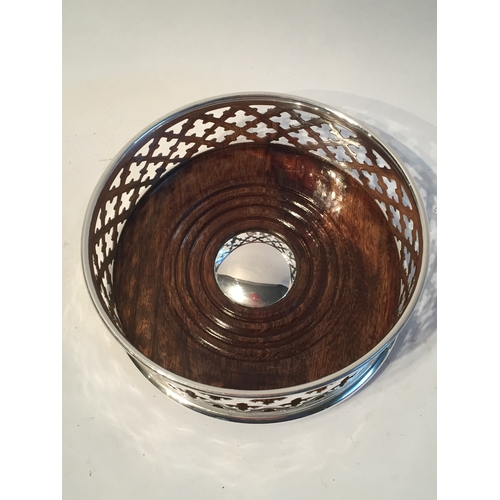 127 - A silver plated Wine Or Champagne Coaster.