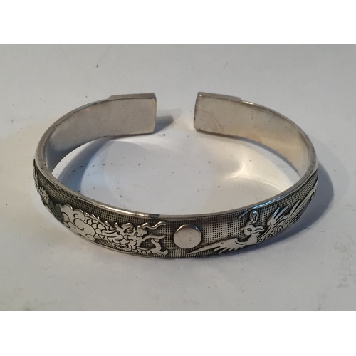 133 - silver coloured Chinese bangle