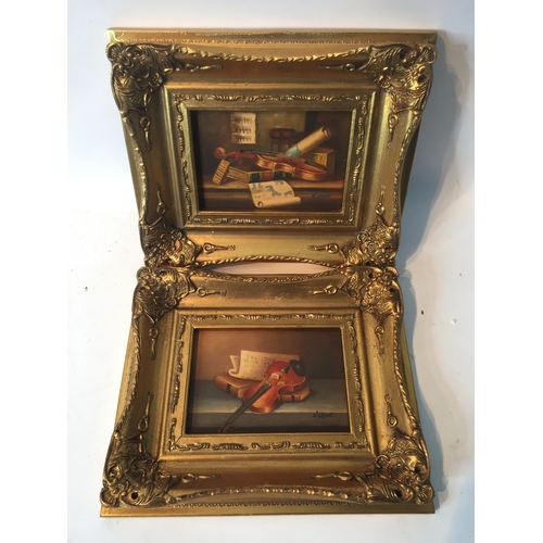 94 - Pair Of gilt Framed Signed Oil On Board Musical Instrument Paintings