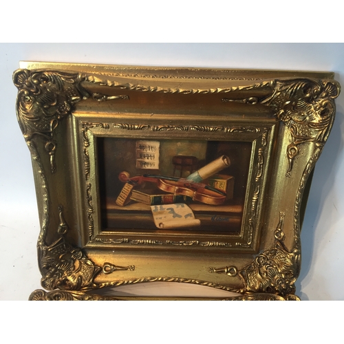 94 - Pair Of gilt Framed Signed Oil On Board Musical Instrument Paintings