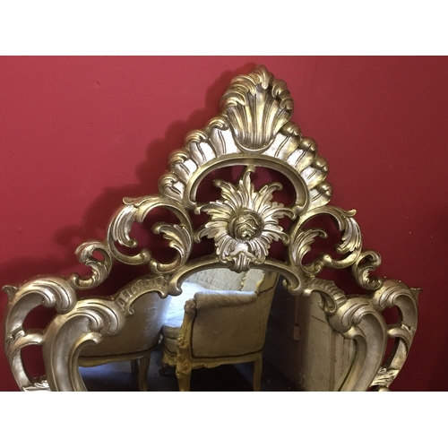 32 - Large Silver rococo Mirror measures 141x80cms at the widest piont